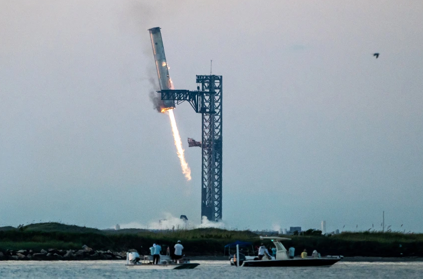 Starship's Super Heavy Booster is grappled at the launch pad in Starbase near Boca Chica, Texas, on Sunday.AFP Contributor#AFP / AFP - Getty Images