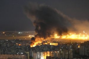 Flames and smoke rise form an Israeli airstrike on Dahiyeh, in the southern suburb of Beirut, Lebanon, on Sunday. Hussein Malla/AP